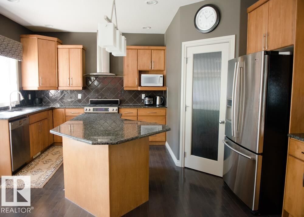 Property Photo:  6162 Maynard Crescent NW  AB T6R 0H8 
