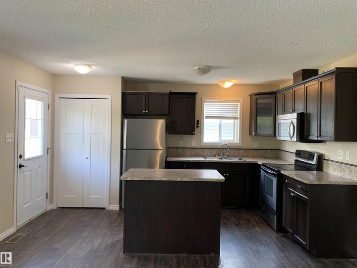Property Photo: 11824 93 Street NW AB T5G 1E3