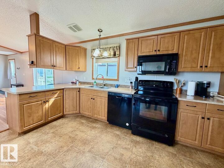 Property Photo:  110 2251 50 Street  AB T7A 1W1 