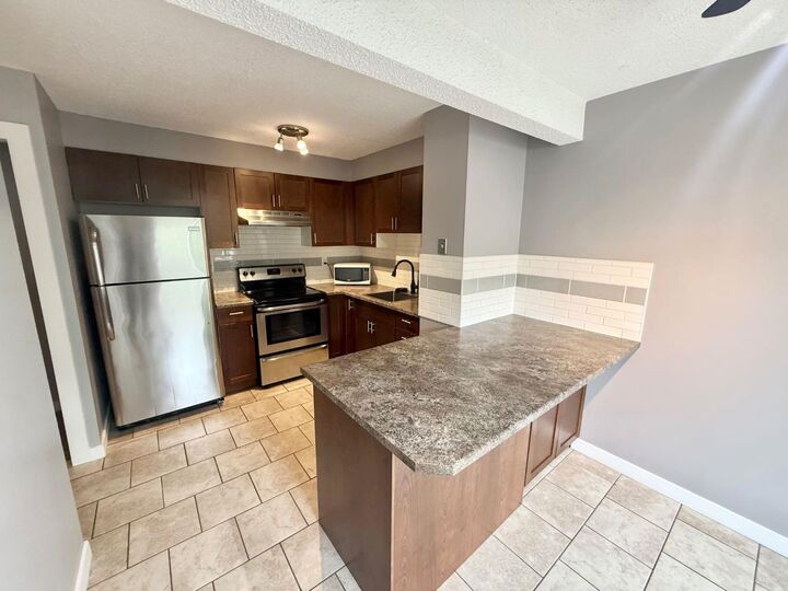 Property Photo: 110 Tamarack Avenue 26 AB T7V 1C5