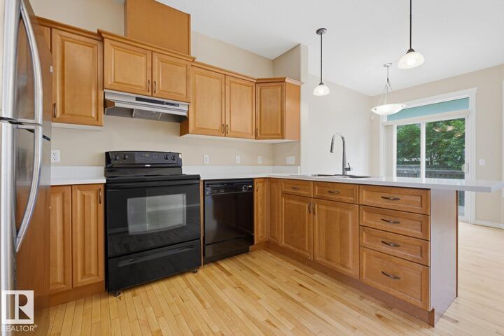 Property Photo:  11612 11 Avenue SW  AB T6W 1W8 