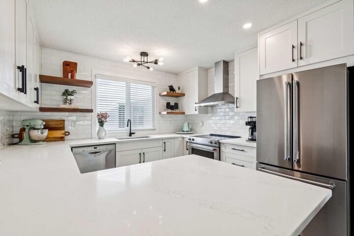 Property Photo:  12019 Canfield Green SW  AB T2W 1V3 