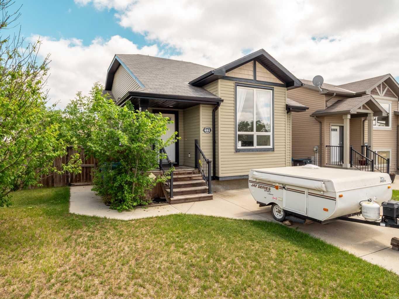 Property Photo:  491 Lettice Perry Road N  AB T1H 5P1 