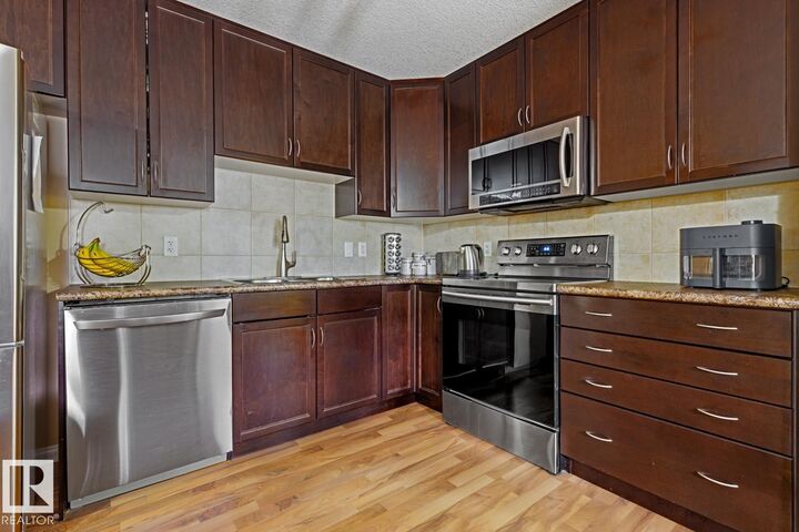 Property Photo: 1204 156 Street NW 211 AB T6R 0R6
