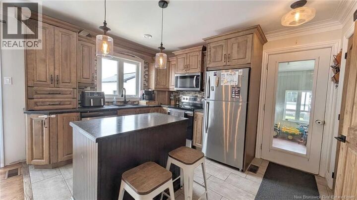 Property Photo:  4325 Boulevard Des Fondateurs  NB E8M 1G9 