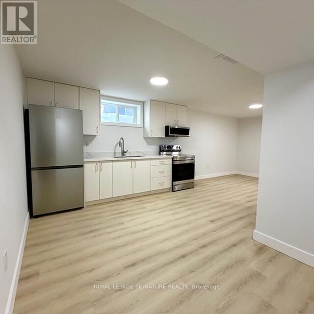 Property Photo:  293 Glebemount Avenue Lower  ON M4C 3V4 