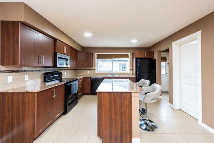 Property Photo: 212 Panatella Drive NW AB T3K 0T4