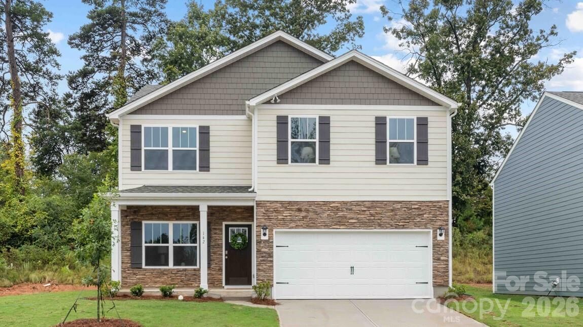 Price-reduced 4-bedroom new home for sale at 5128 Parker Forest Road, Charlotte NC 28215 in Reedy Creek Preserve