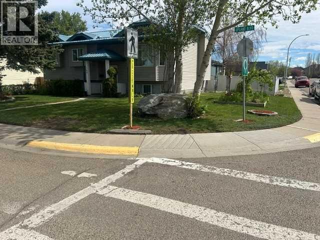Property Photo: 144 Upland Boulevard West AB T1R 0R3