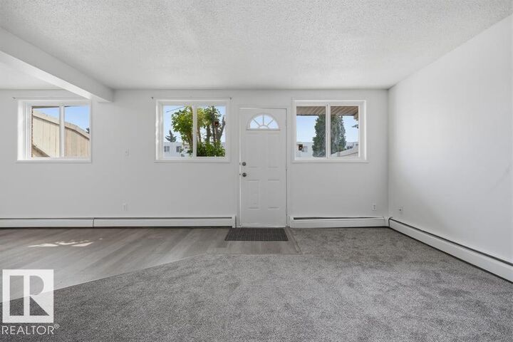 Property Photo:  14530 52 Street NW 105  AB T5A 3K5 