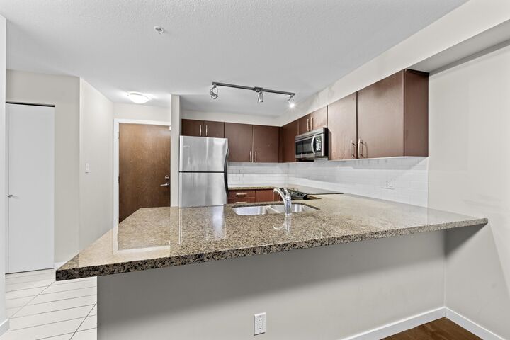 Property Photo:  7337 Macpherson Avenue 209  BC V5J 0A9 
