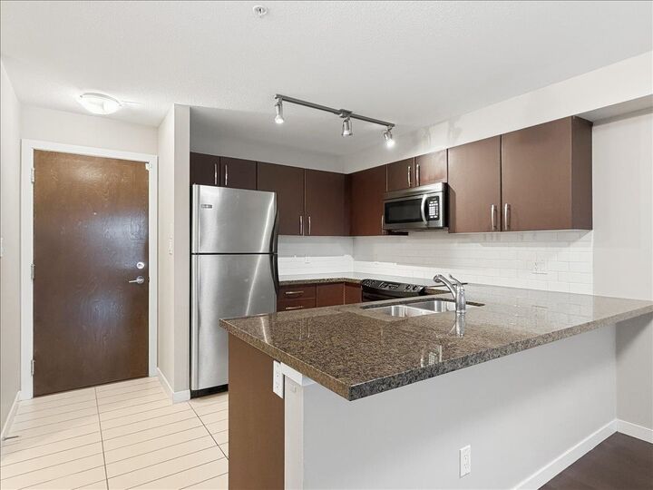 Property Photo: 7337 Macpherson Avenue 209 BC V5J 0A9