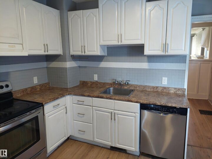 Property Photo:  11238 123 Street NW  AB T5M 0M6 