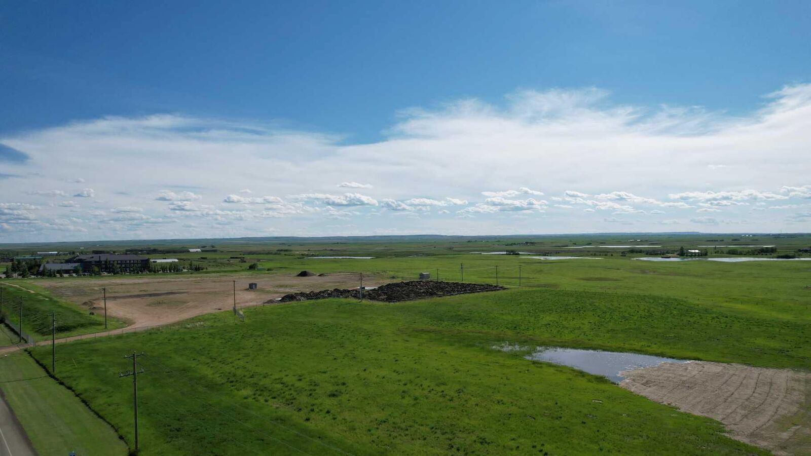 Property Photo: 605 Palliser Trail AB T0J 1P0