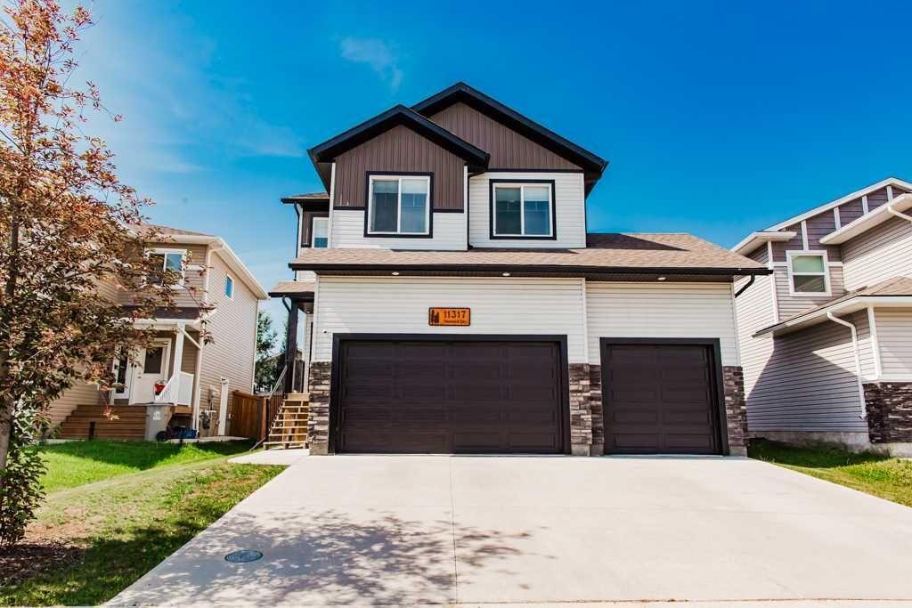Property Photo: 11317 Tamarack Drive AB T8W 0L1