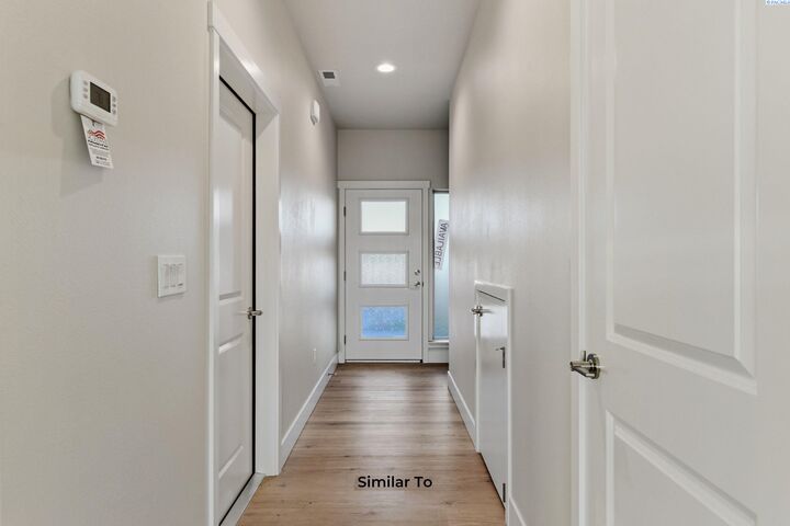 Property Photo:  205 N Dewberry Pl  WA 99336 