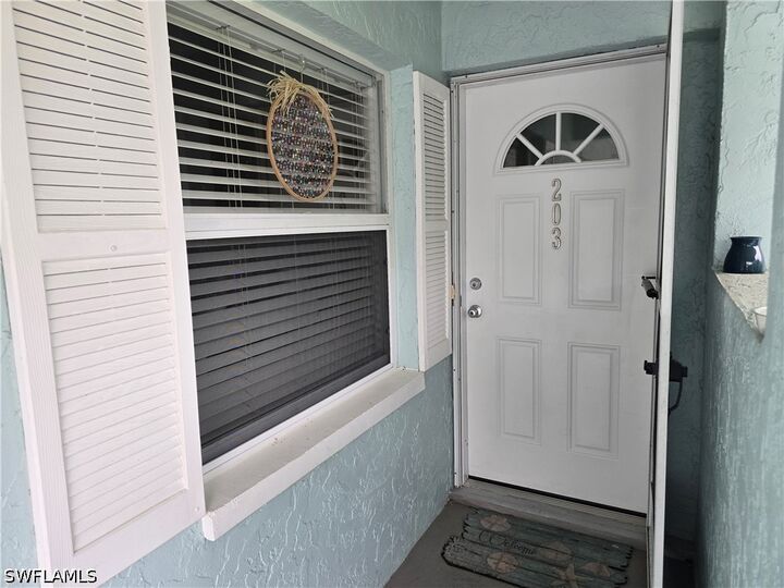 Property Photo:  5741 Whitaker Road D203  FL 34112 