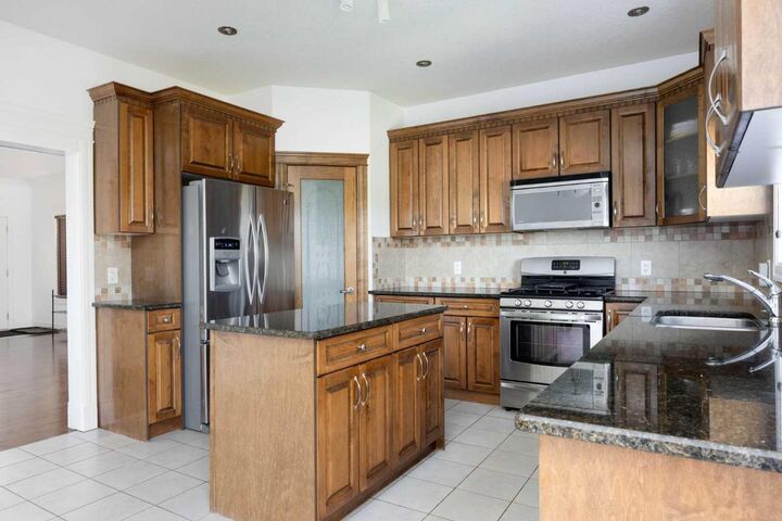 Property Photo:  322 Grosbeak Way  AB T9K 0L8 