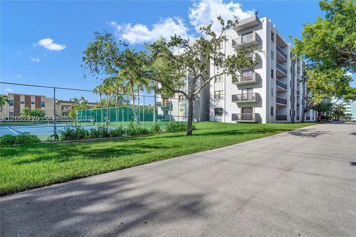 Property Photo:  1301 NE 7th 405  FL 33009 