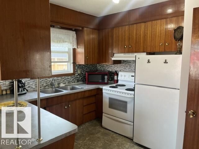Property Photo: 5213 50 Avenue AB T9C 1M5
