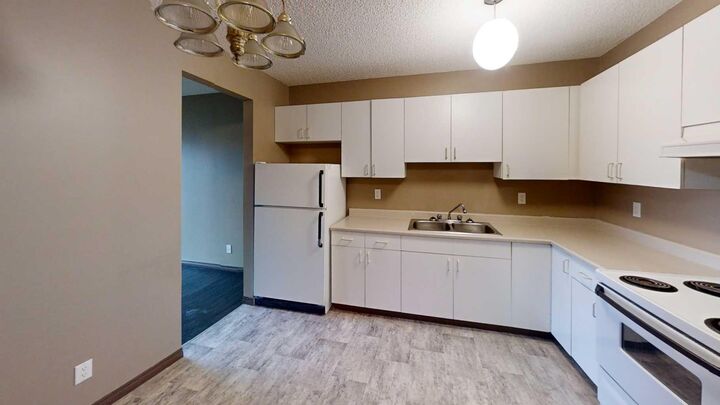 Property Photo: 5117 44 Street 205 AB T0G 1E0