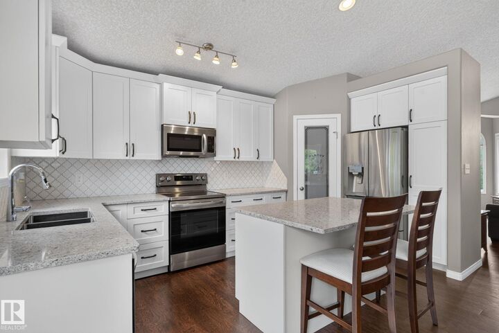 Property Photo:  4914 152A Avenue NW  AB T5Y 3C1 