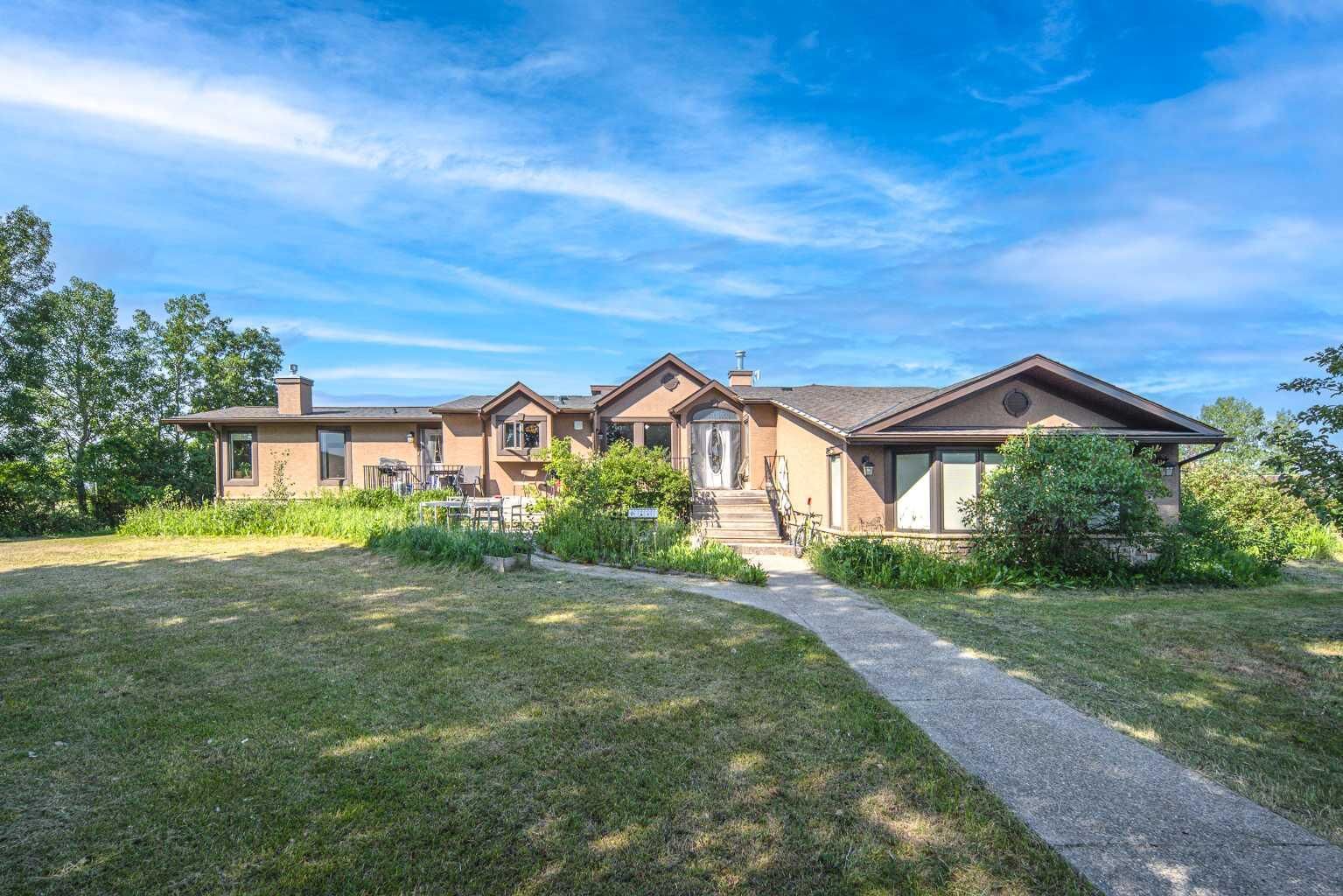 Property Photo: 33076 Township Road 243 AB T3Z 2M6