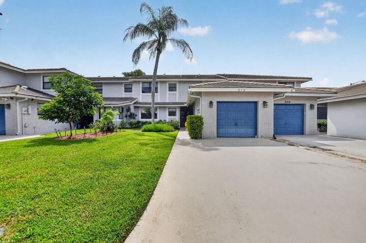 Property Photo: 310 Deer Creek Lakeside Way FL 33442