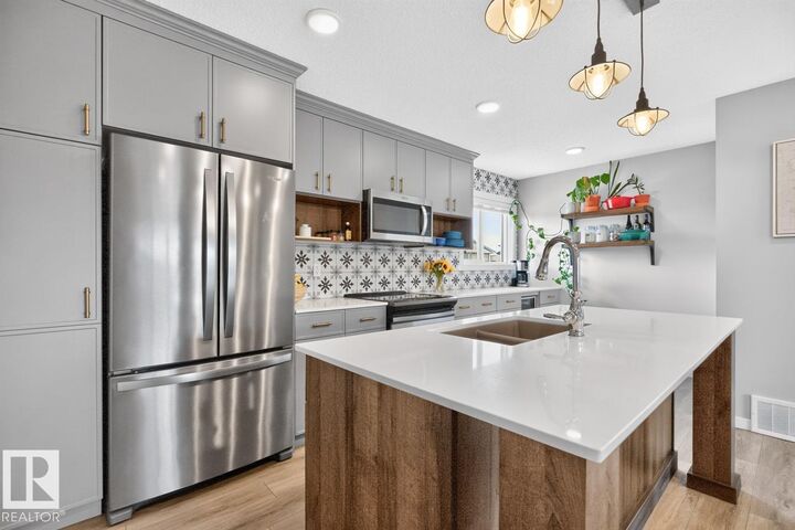 Property Photo:  1051 Cy Becker Road NW  AB T5Y 4B7 