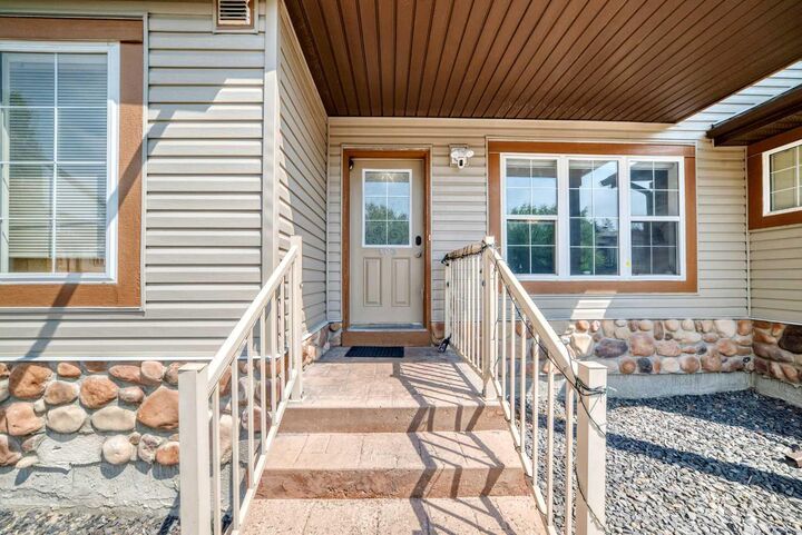 Property Photo: 160 Panatella Landing NW 103 AB T3K 4Y3