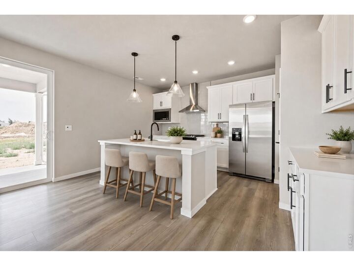 Property Photo:  7336 Swan River St  CO 80530 