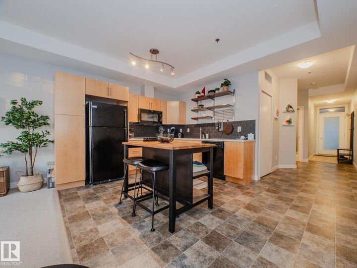 Property Photo:  10808 71 Avenue NW 310  AB T6E 0X7 