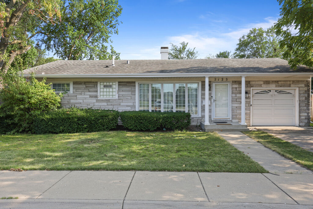 Property Photo:  7125 Simpson Street  IL 60053 