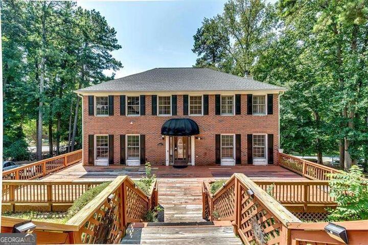 Property Photo:  6963 Whispering Oaks Court  GA 30087 