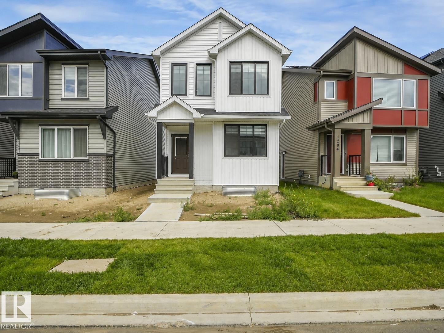 Property Photo: 1206 Keswick Drive SW AB T6W 4J9