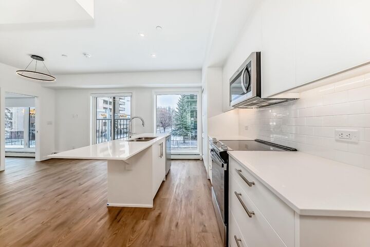 Property Photo: 310 15 Avenue SW 209 AB T2R 1S9