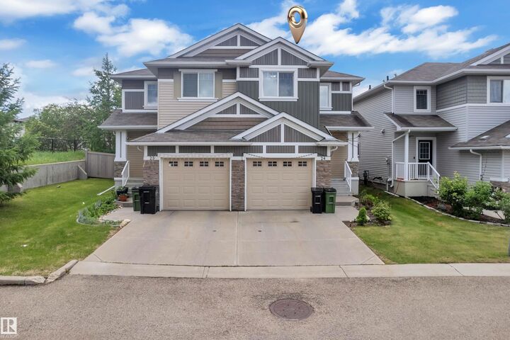 Property Photo: 655 Tamarack Road NW 24 AB T6T 0N4