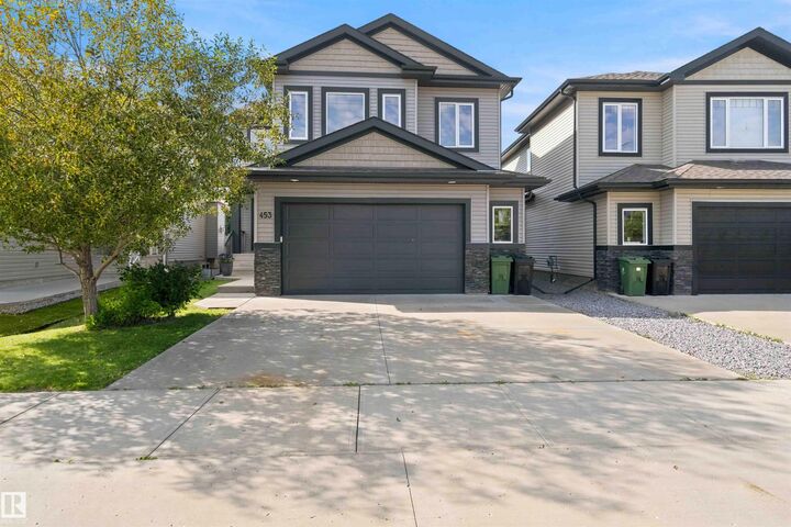 Property Photo: 453 Meadowview Drive AB T8L 0N9
