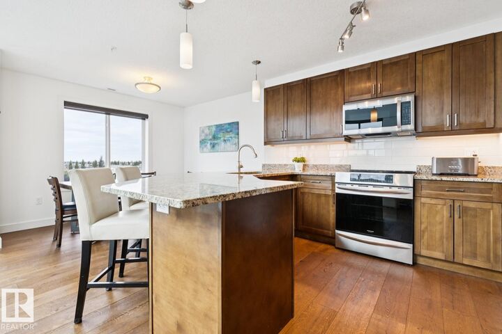Property Photo: 1238 Windermere Way SW 506 AB T6W 2J3
