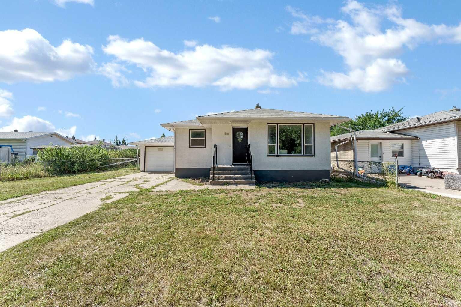Property Photo:  56 Robertson Way SW  AB T1A 5J2 