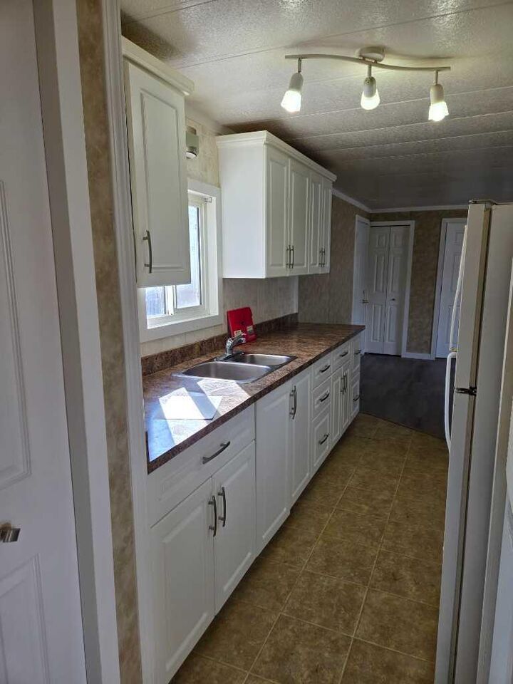 Property Photo:  6220 17 Avenue SE 26  AB T2A 0W6 