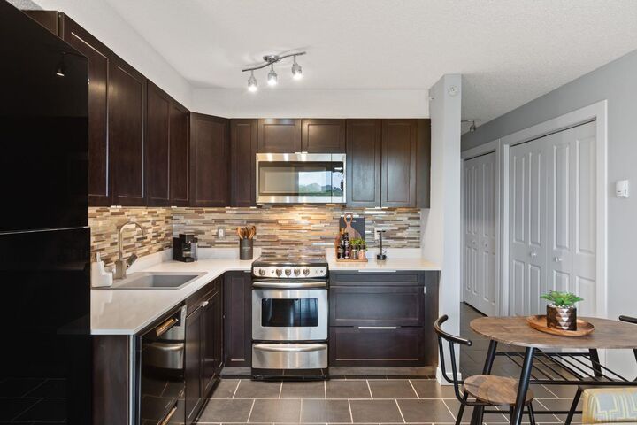 Property Photo:  1620 70 Street SE 4409  AB T2A 7Z2 