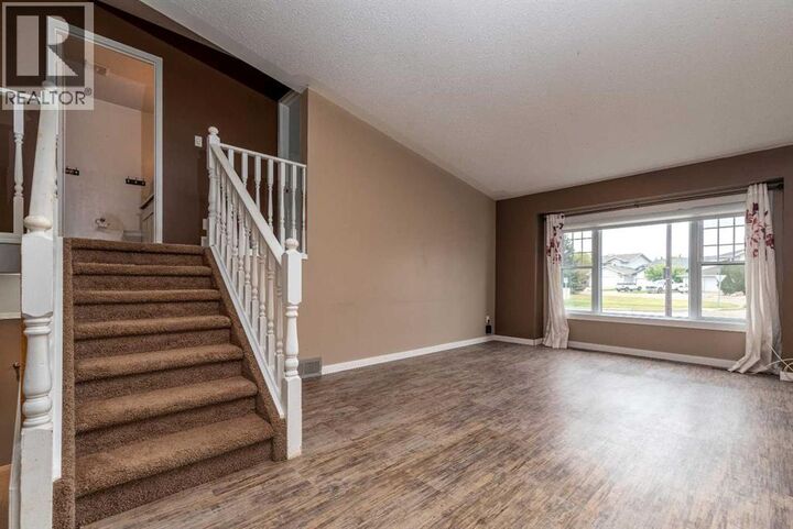 Property Photo:  2718 57A Avenue  AB T9V 2N2 