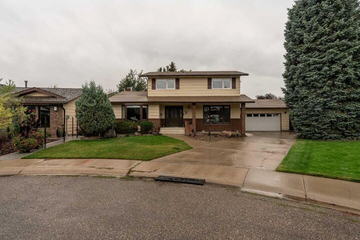Property Photo:  310 Kings Bay S  AB T1K 5G2 