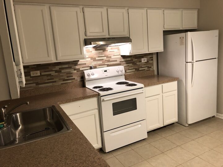 Property Photo: 1211 Whispering Hills Court 1A IL 60540