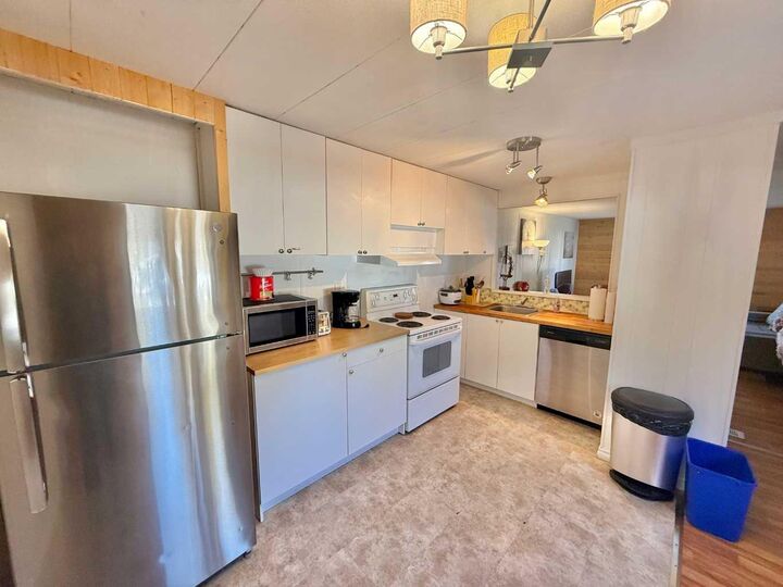 Property Photo: 726 Carmichael Lane 10 AB T7V 1T1
