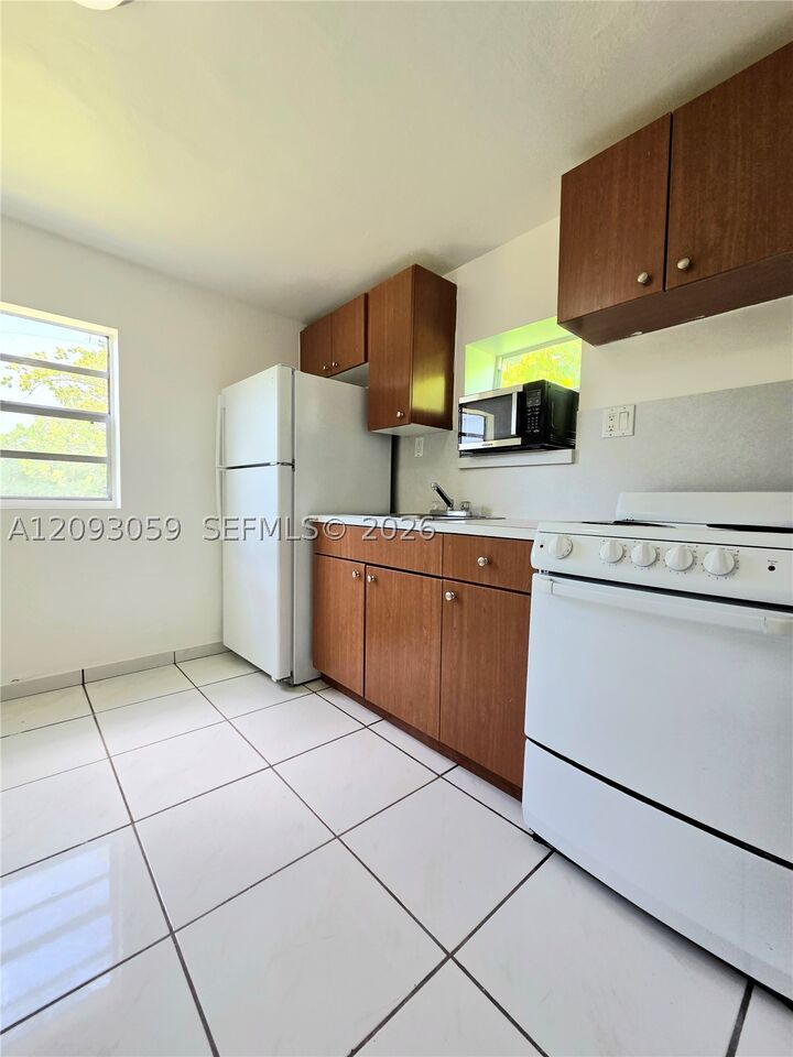 Property Photo:  1619 NW 27 St Rear  FL 33142 