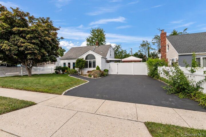 Property Photo: 61 Hollyhock Road NY 11756