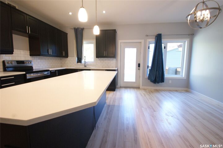 Property Photo:  1303A Broadway Avenue  SK S7H 2A5 