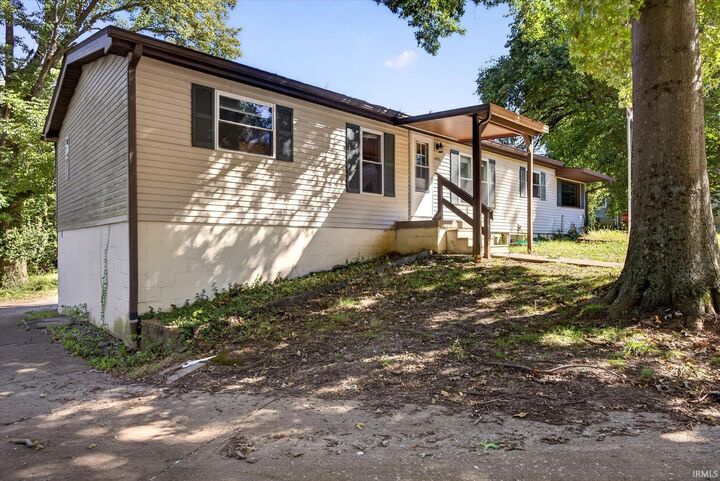 Property Photo:  1201 W Green Tree Lane  IN 47403 